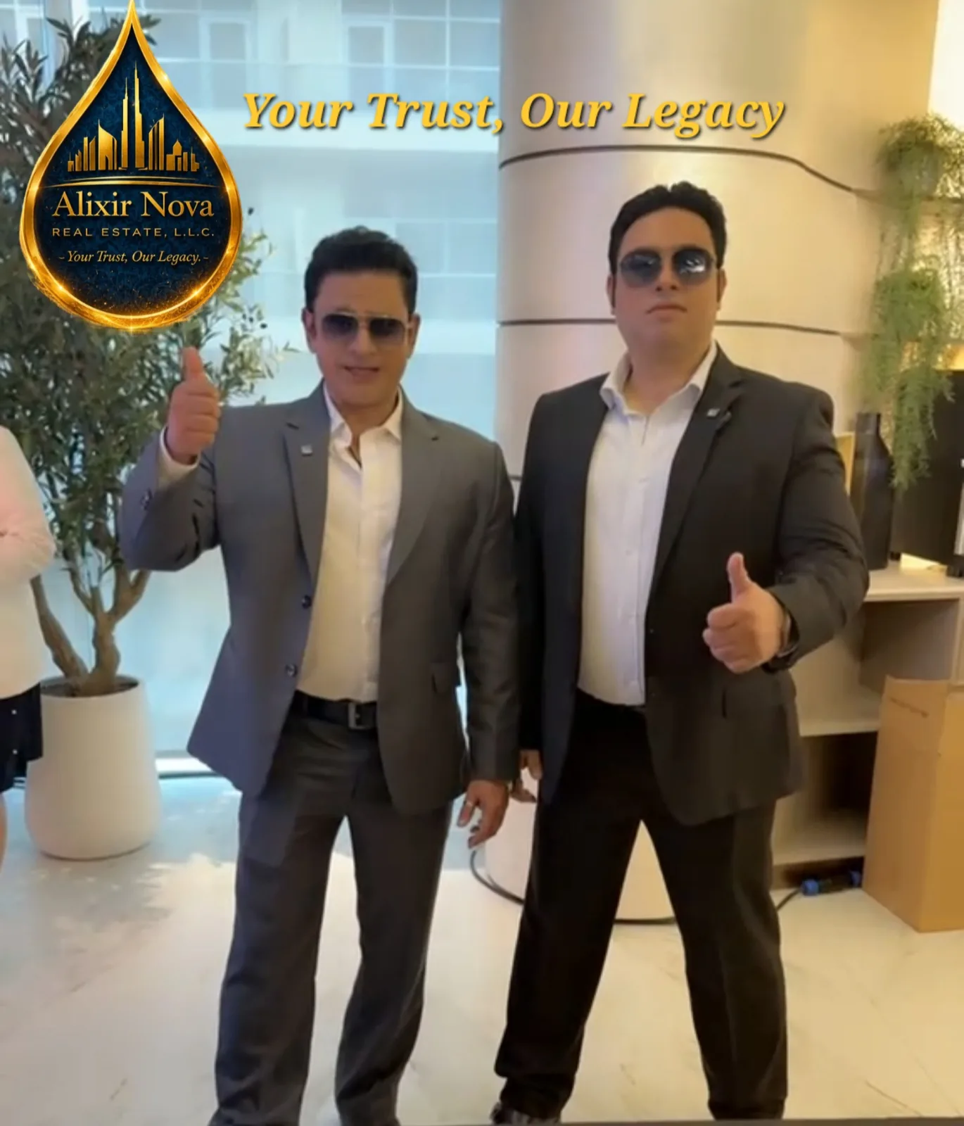 AlixirNova Real Estate team members in a Dubai property showroom under the "Your Trust, Our Legacy" banner